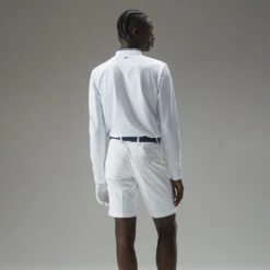 J.Lindeberg Tyson Long Sleeve Golf Polo Shirt -Golf Apparel Shop J.Lindeberg Tyson LS Reg Fit Polo GMJT07801 0000 SHLIN154 WhiteNavy Peony Model 3